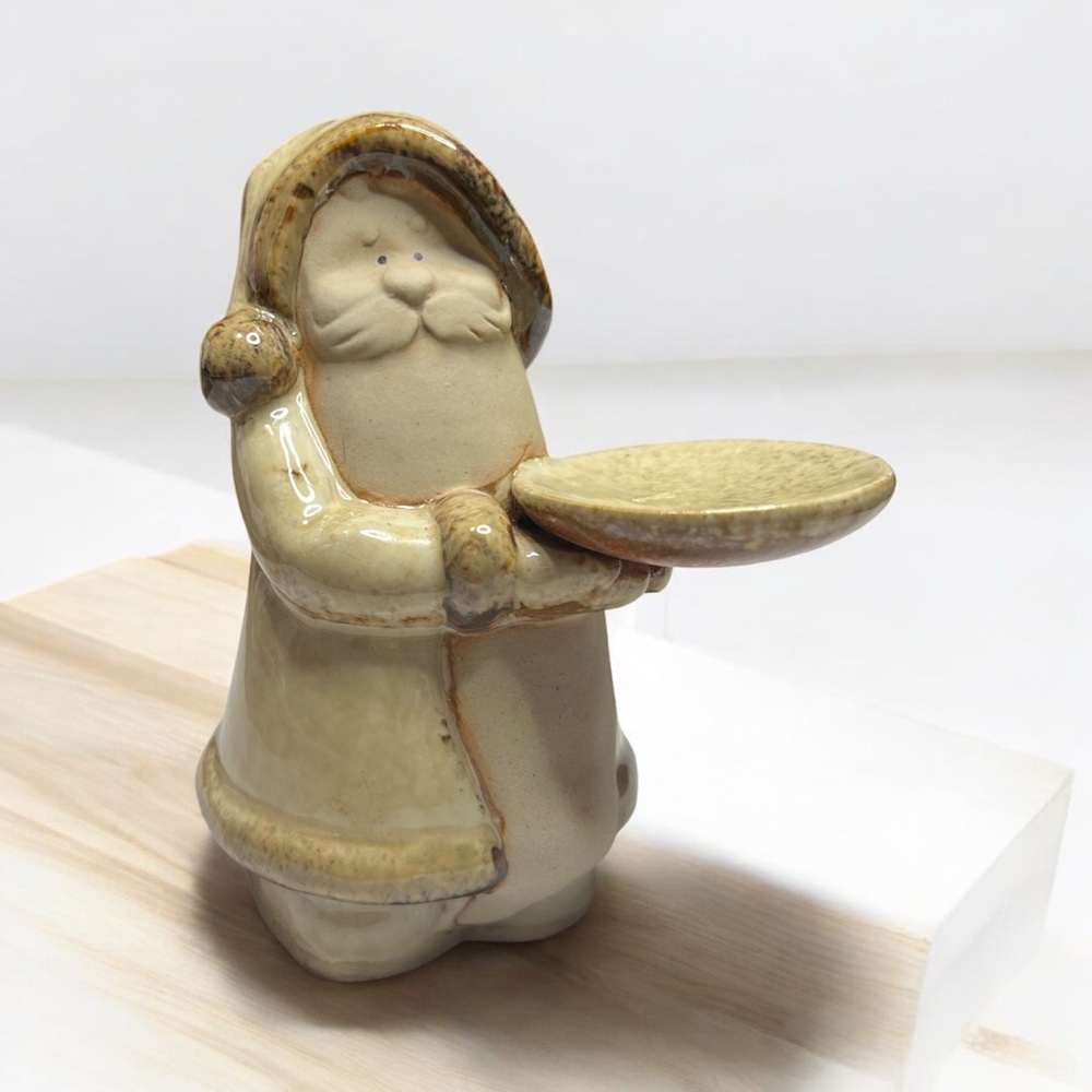 Glazed ceramic Santa Claus holding a tray for candle or‎ trinket. Monochromatic